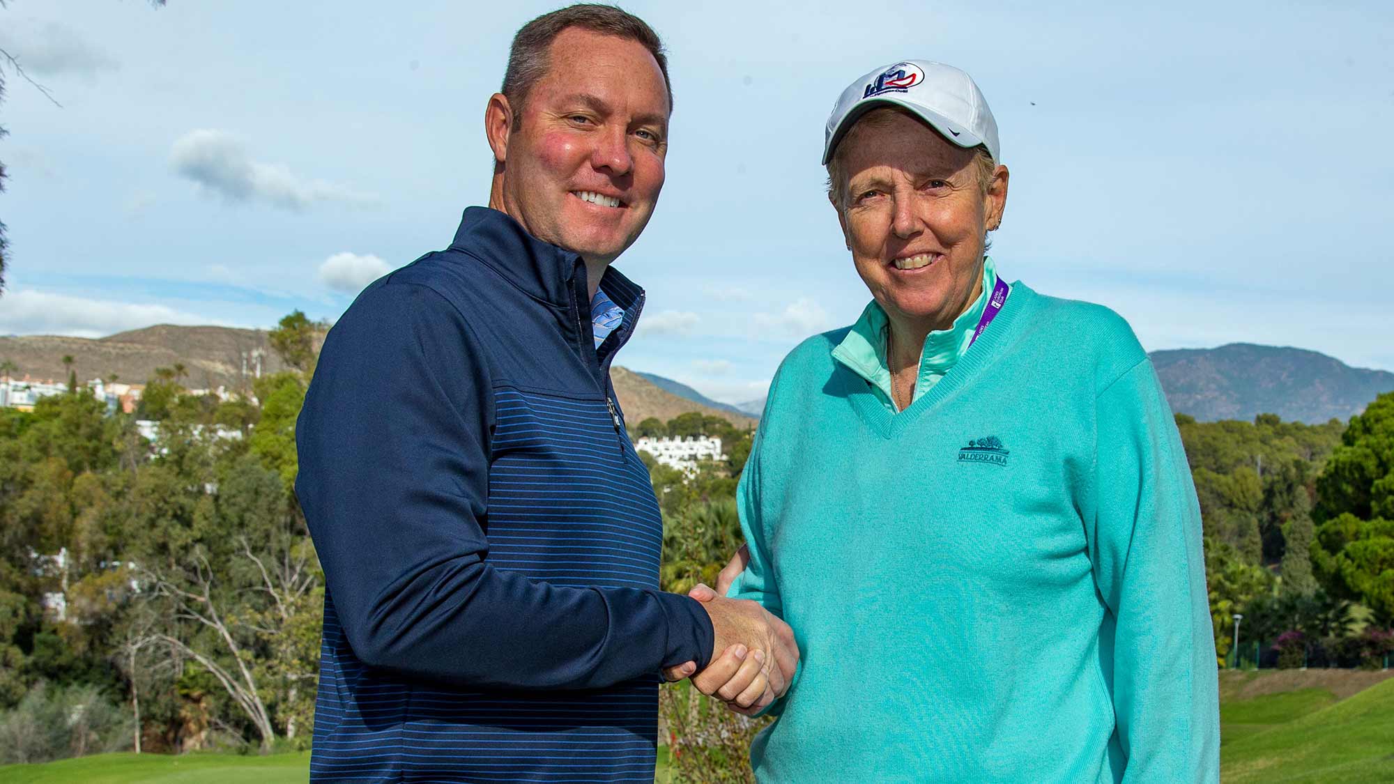 LPGA Commissioner Mike Whan and the Ladies European Tour's Board Chair Marta Figueras-Dotti shake hands on Tuesday following the LET's Annual Membership Meeting in Spain