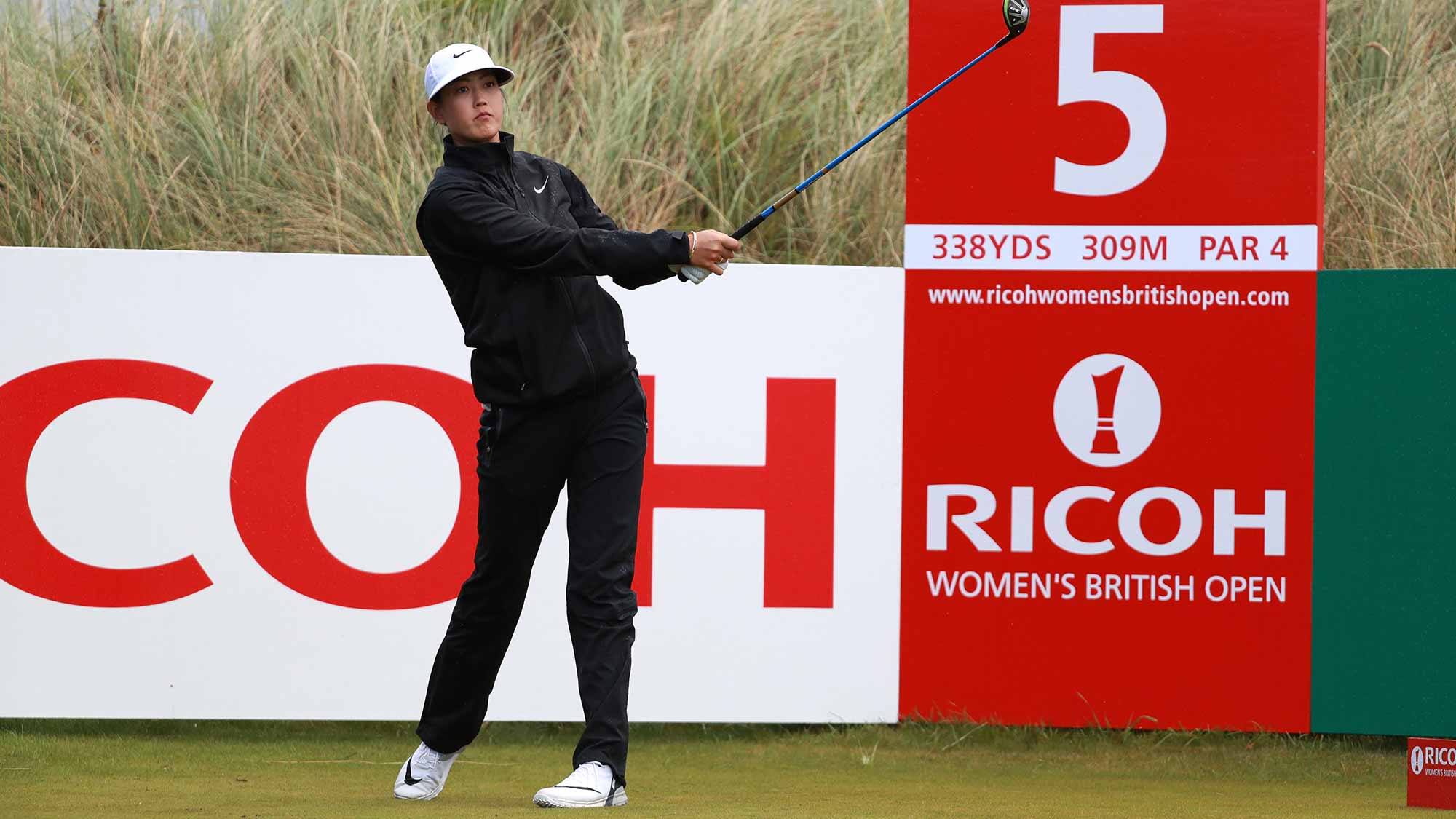 Michelle Wie of the United States tees off on the 5th hole during a pro-am round prior to the Ricoh Women's British Open at Kingsbarns Golf Links