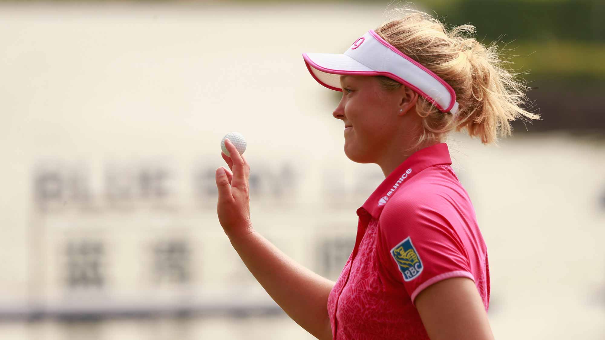 Brooke M. Henderson of Canada acknowledge to spectators after her putt at 18th hole in Round 3 of Blue Bay LPGA of Day 3