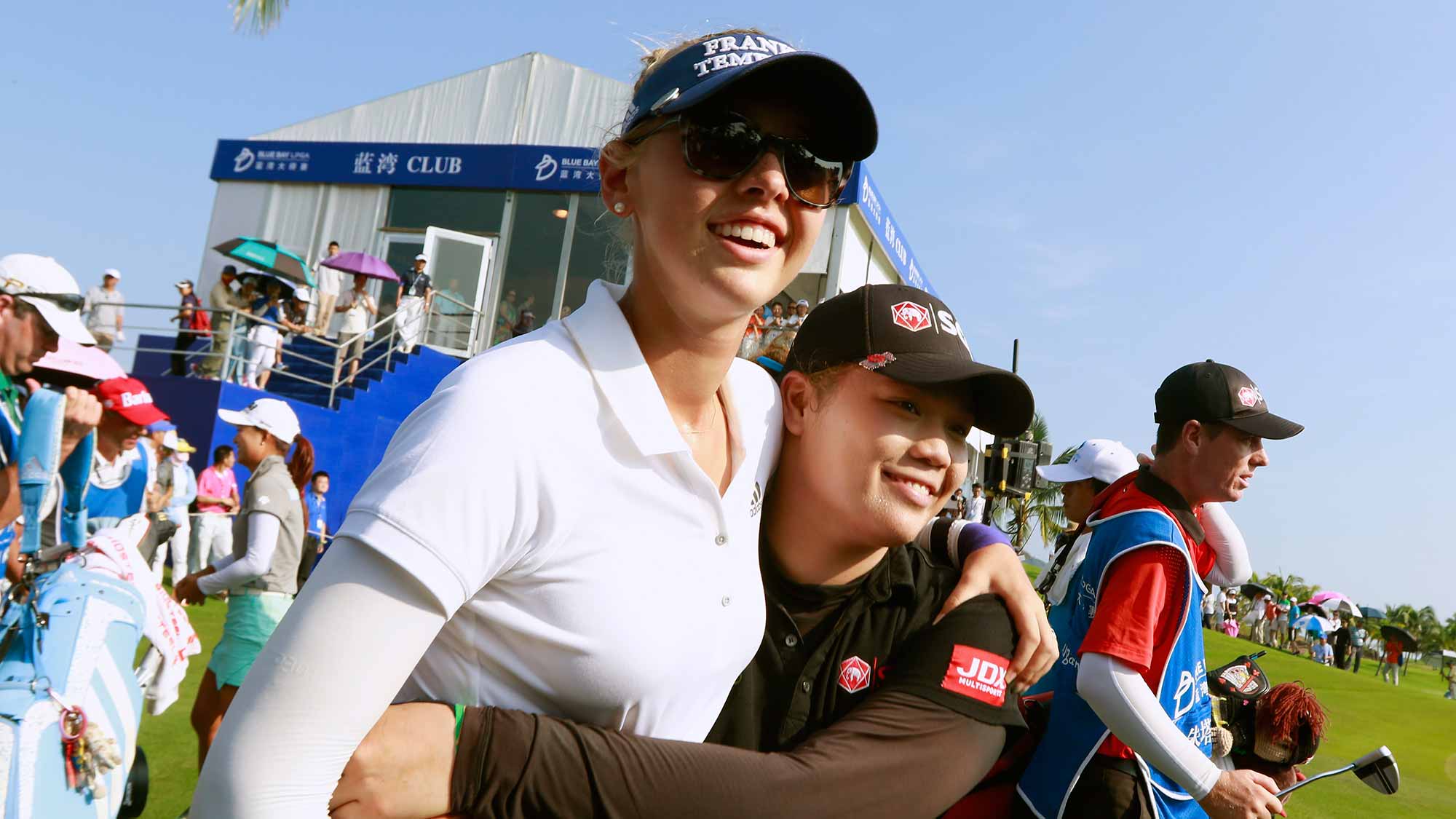 Ariya Jutanugarn of Thailand and Jessica Korda interact on the 18th green after the final round of the Blue Bay LPGA on Day 4 