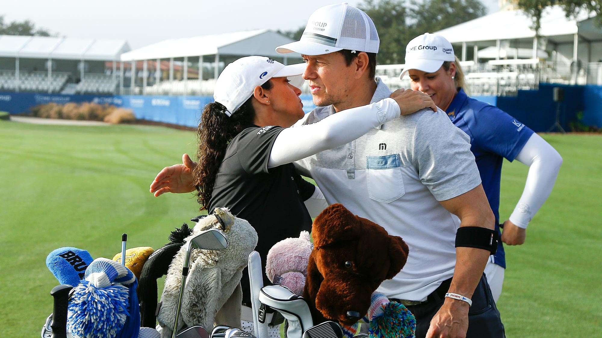 Actor Mark Wahlberg greets LPGA golfer Mo Martin prior to the CME Group charity event to benefit St. Jude Children's Research Hospital prior to the LPGA CME Group Tour Championship