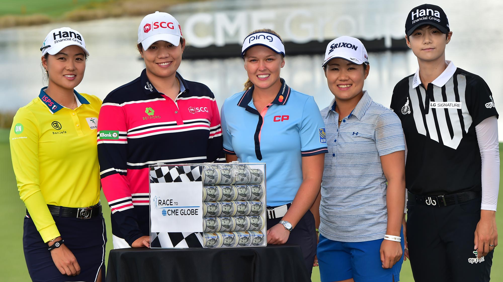(left to right) Minjee Lee of Australia, Ariya Jutanugarn of Thailand, Brooke Henderson of Canada, Nasa Hataoka of Japan and Sung Hyun Park of South Korea pose for a photo with the Race for the CME Globe Money Box on the 18th green prior to the LPGA CME Group Tour Championship