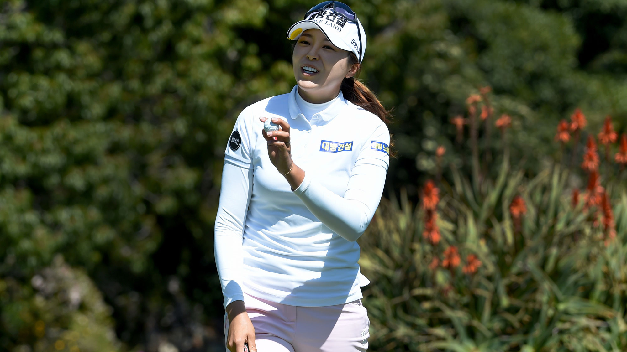 Mi Jung Hur of Korea reacts after sinking her putt on the 18th green and shooting a course record 10 under par 62 during the third round of the Kia Classic 
